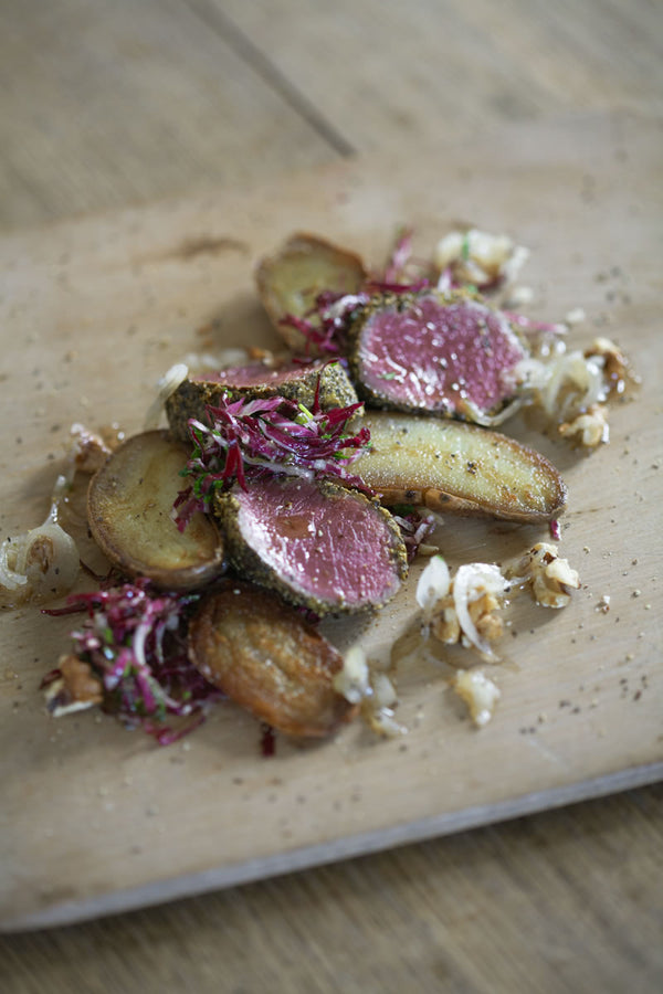 Peppered Venison served rare with Shetland Black potatoes.